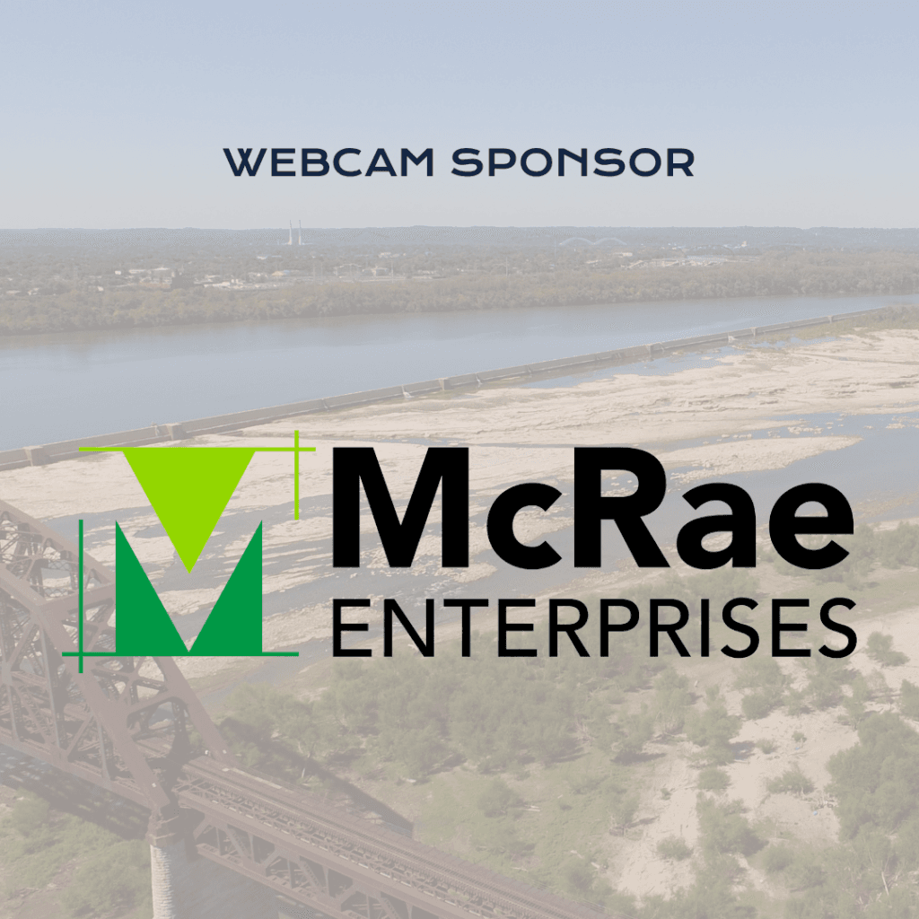 Webcam Sponsor A logo for McRae Enterprises, labeled as Webcam Sponsor, is displayed over a scenic river and bridge background.